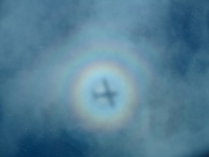 Circular Rainbow –  known as a Glory – made by an airplane when the shadow hit a cloud flying en route Honolulu to Molokai 2014 :)) 